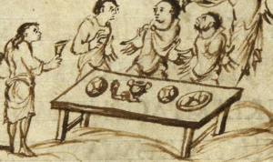 Szene aus dem Utrechter Psalter: auf dem Tisch liegen u.a. zwei Brote